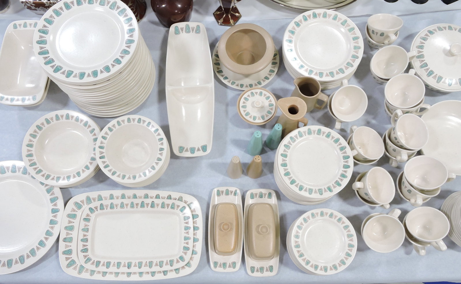 MCM Metlox Poppy Trail Navajo set: of dinnerware, 125 +/- pcs: 3 platters, divided relish, cream, sugar, tall cream, 2 rectangular vegetable bowls, round covered vegetable bowl, round open vegetable bowl, gravy, 4 soups, 13 bread & but