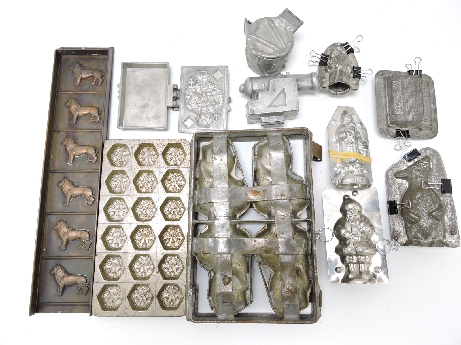 Lot of 11 chocolate and ice cream molds:: Santas, lion, canon, drum, and more