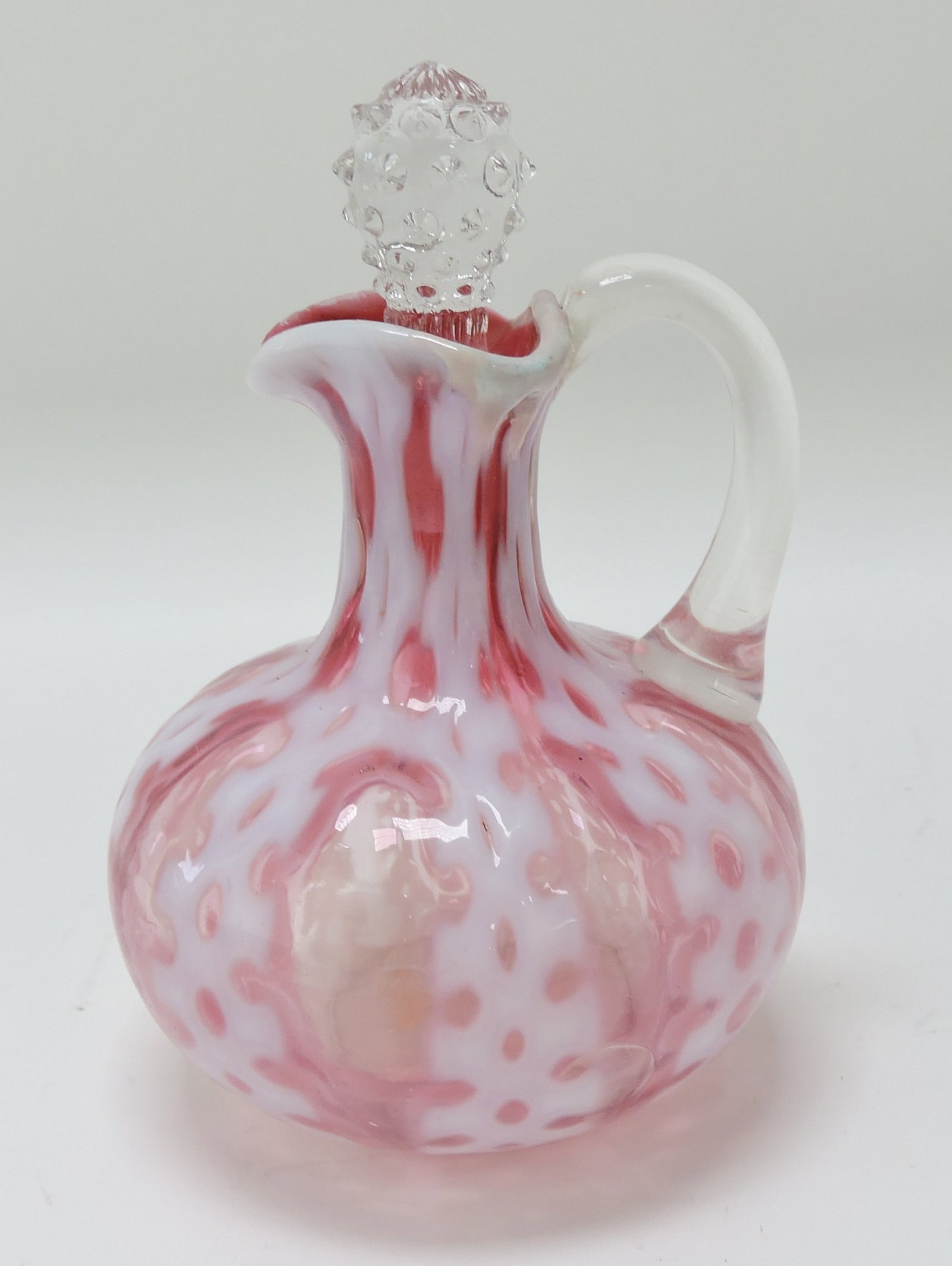 Consolidated cranberry opalescent: criss cross cruet, 5 1/4"