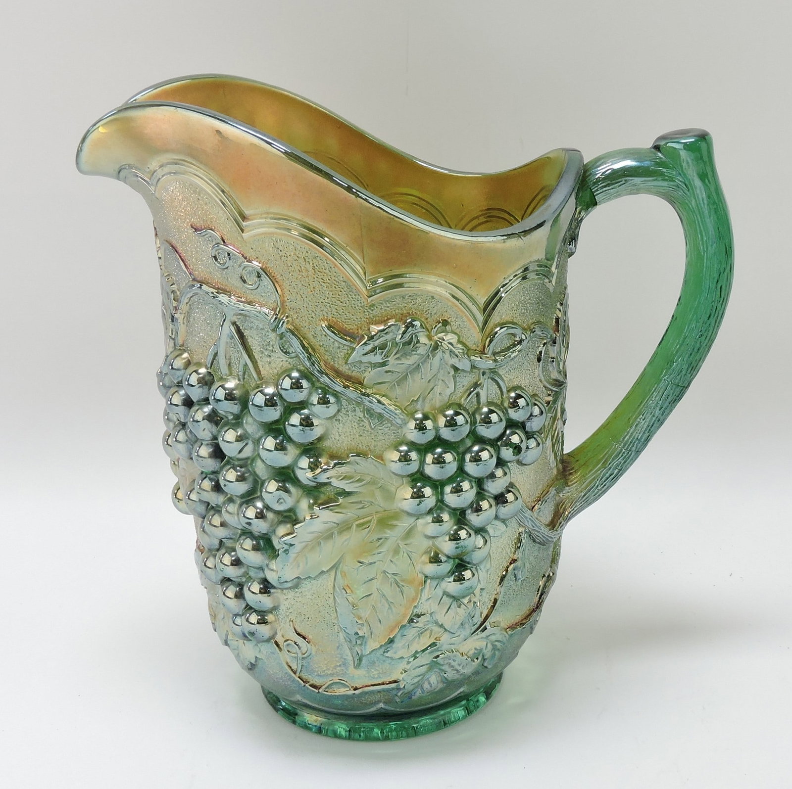 Green carnival glass grape water: pitcher, 8"