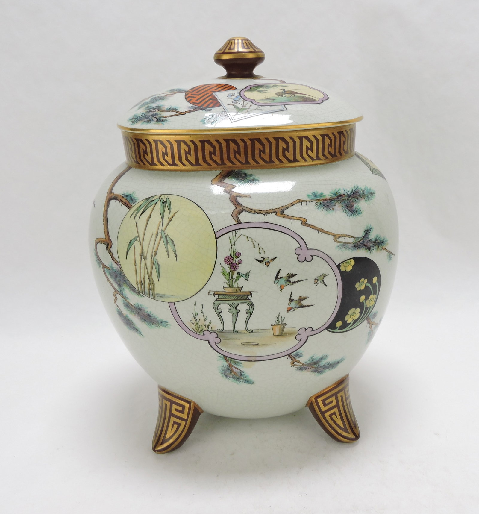 Rare Pinder Bourne Aesthetic Movement: Moon Flask & Cover c.1875, retailed by John Mortlock, Oxford Street, London, the duck egg green body and cover decorated with scattered panels of Japanese motif, with Chinese key to the collar and upo