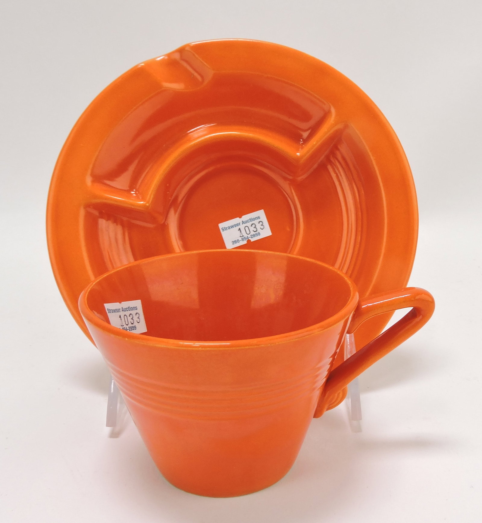 Harlequin saucer ashtray (very minor: glaze nick to rim) and cup, red