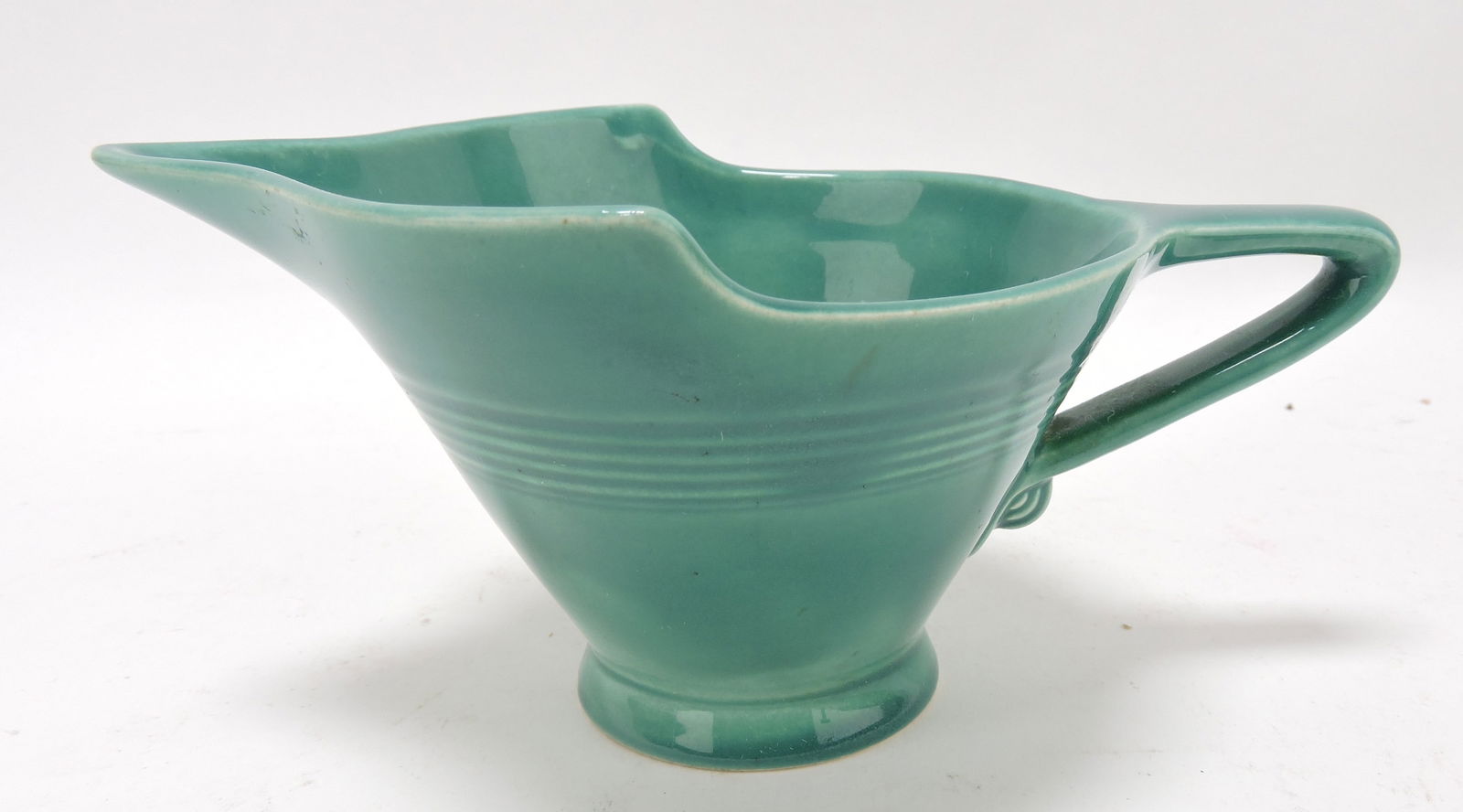 Harlequin high lip creamer, spruce green,: minor nick to foot rim