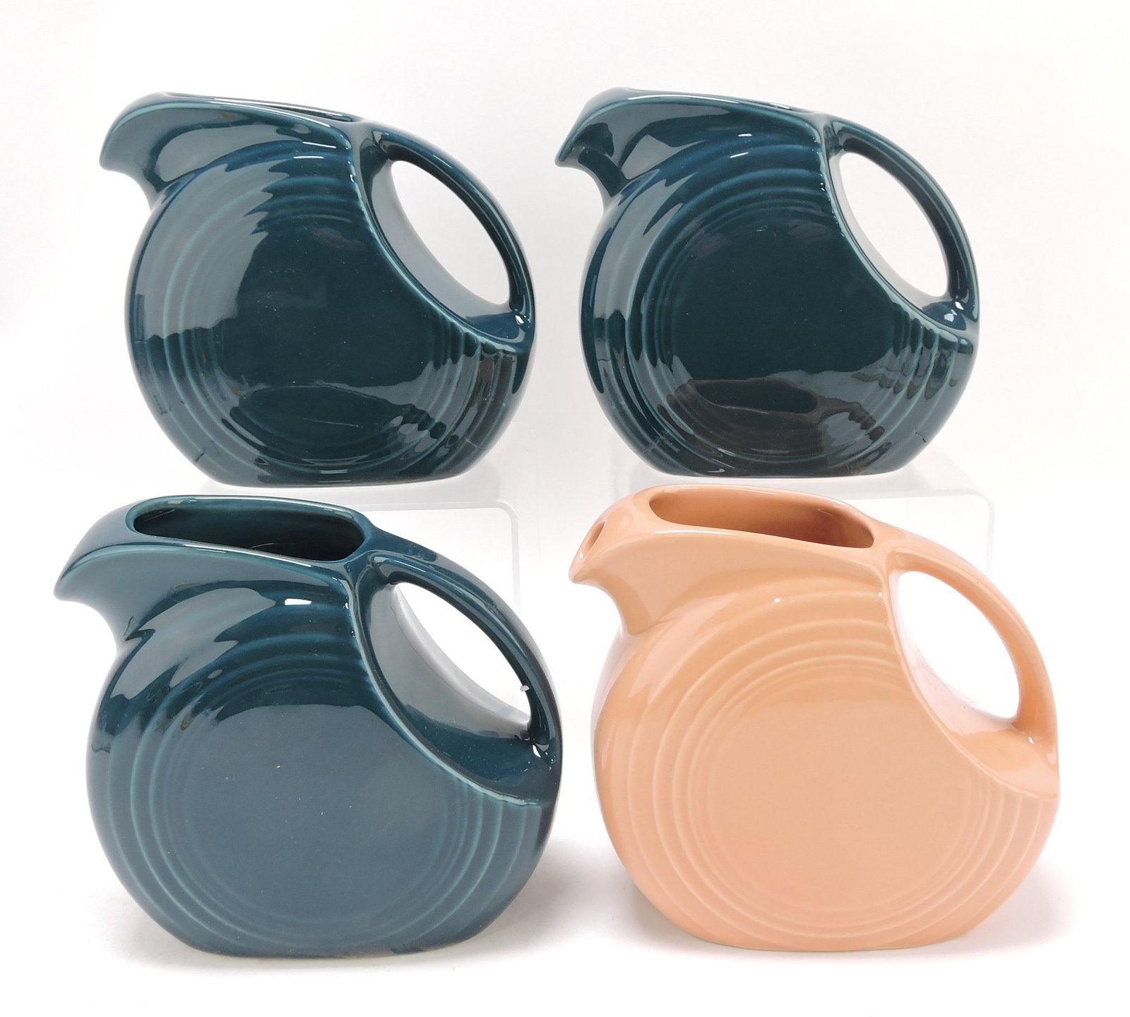 Fiesta Post 86 lot of 4 juice pitchers,: 3 juniper, 1 apricot, 5 1/2"