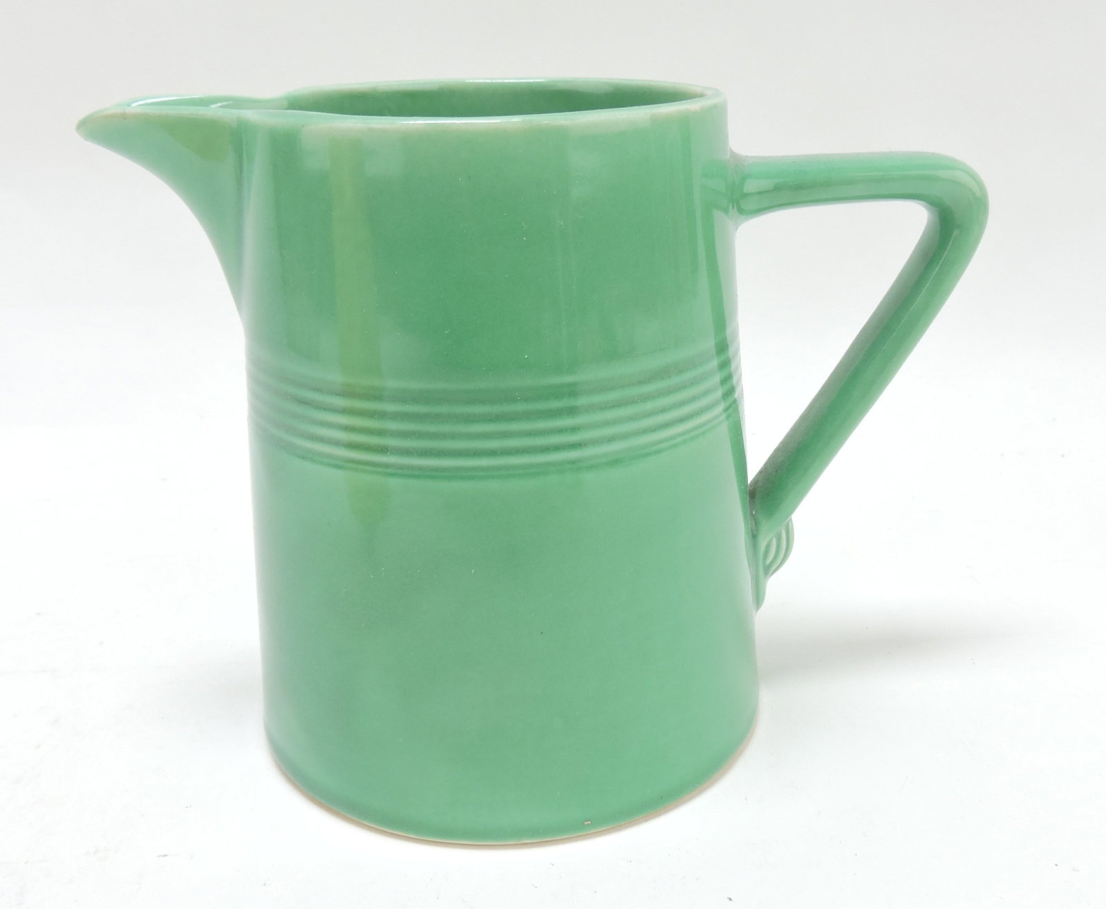 Harlequin 22 oz jug, 4 3/4", green,: spout nick