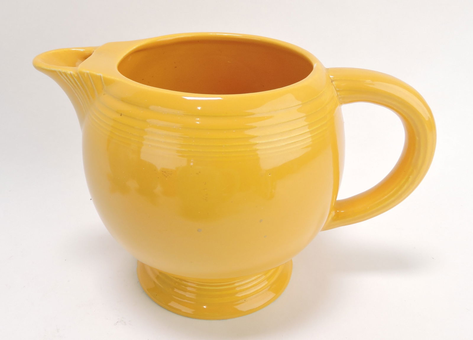 Fiesta ice lip pitcher, yellow, nick to (1 of 1)