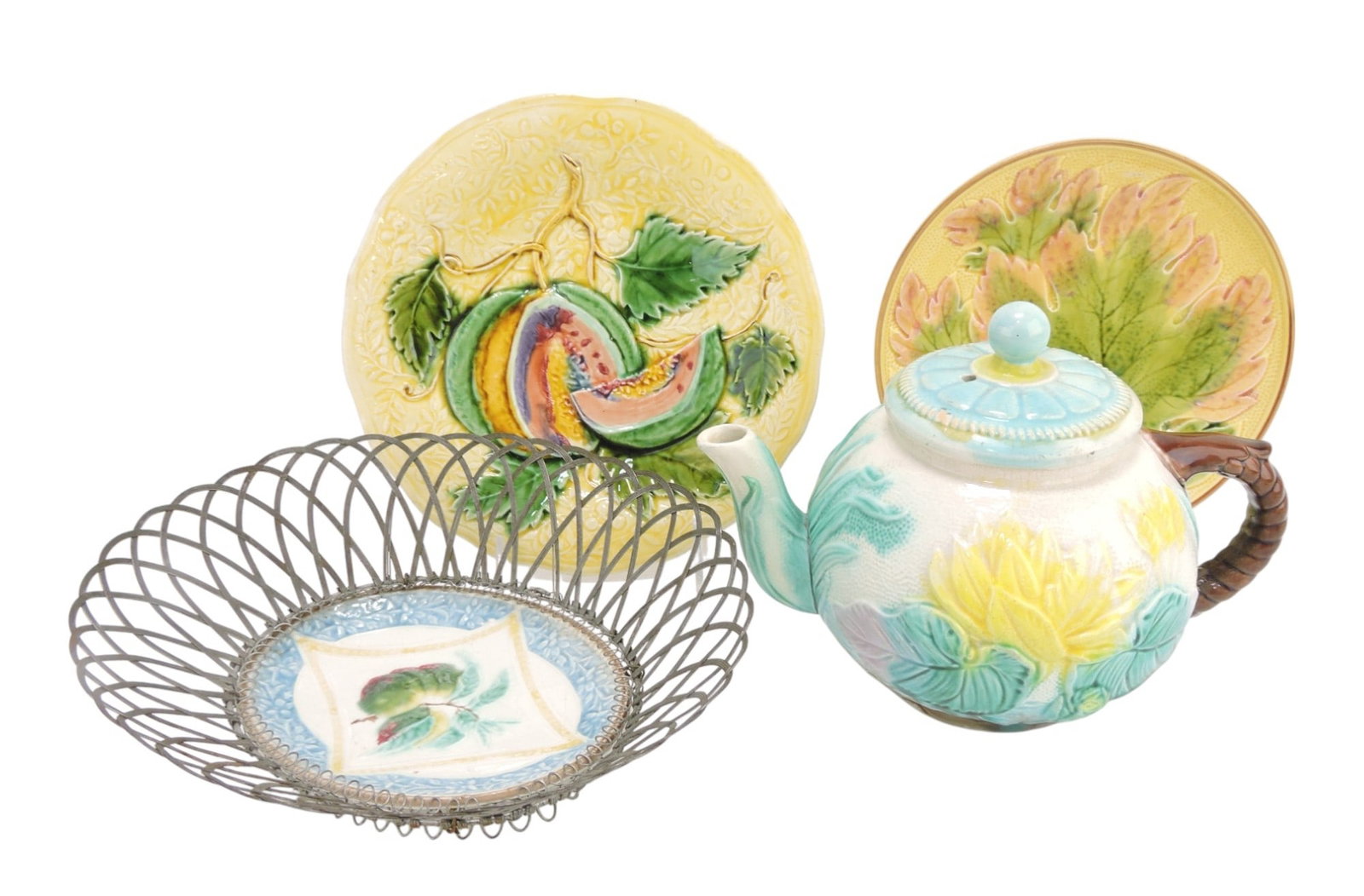 Majolica lot of 4 pieces: 2 plates,: water lily teapot, and oval plate in wire holder, various condition