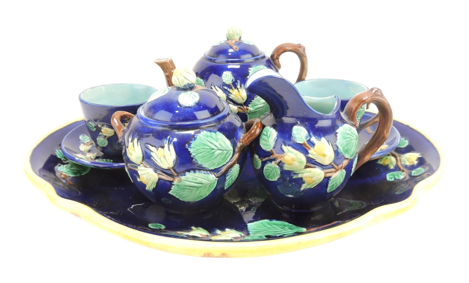 Majolica cobalt tea set with 14 1/2" x: 12" tray, teapot, cream, sugar, and 2 cups & saucers