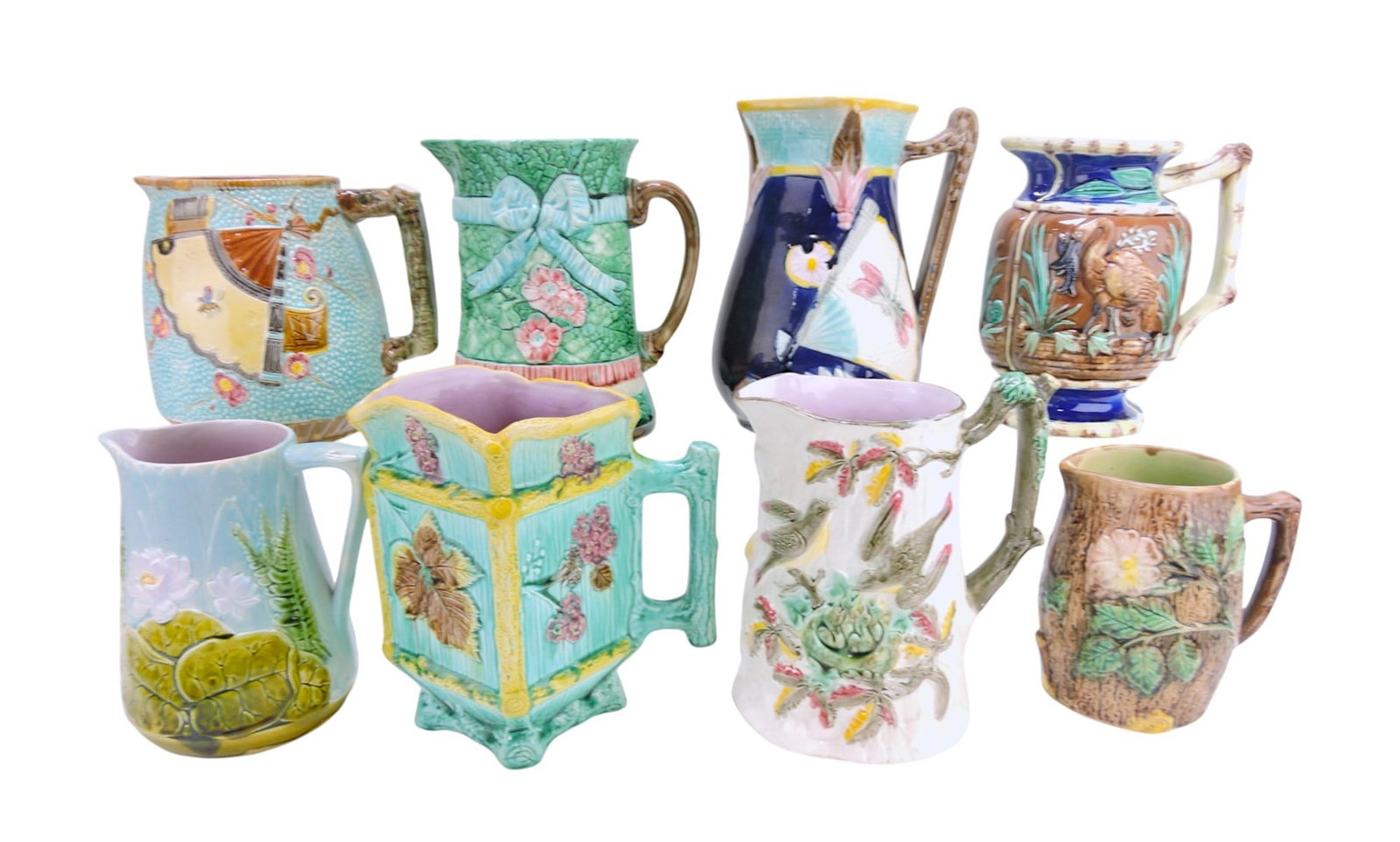 Majolica lot of 8 pitchers, 6 1/2" to: 9 1/2", various condition