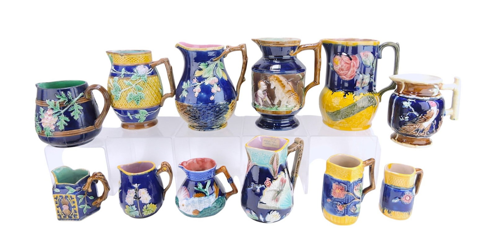 Majolica lot of 12 cobalt pitchers,: 4" to 8", various condition