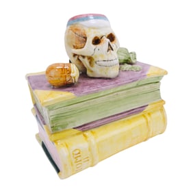Majolica figural humidor of skull atop