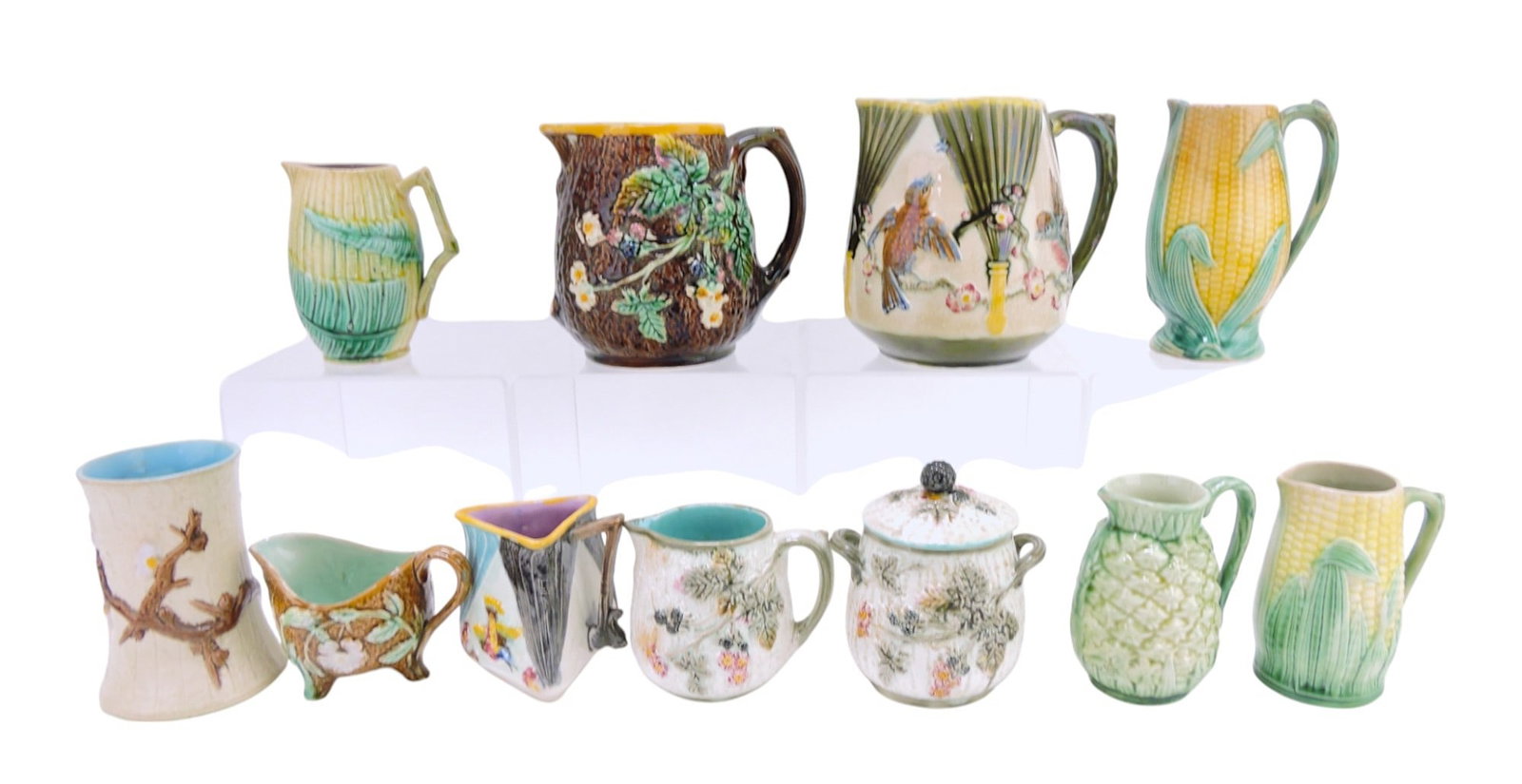 Majolica lot of 11 pieces - 9 pitchers,: spooner, and sugar, various condition, 3" to 5 3/4"