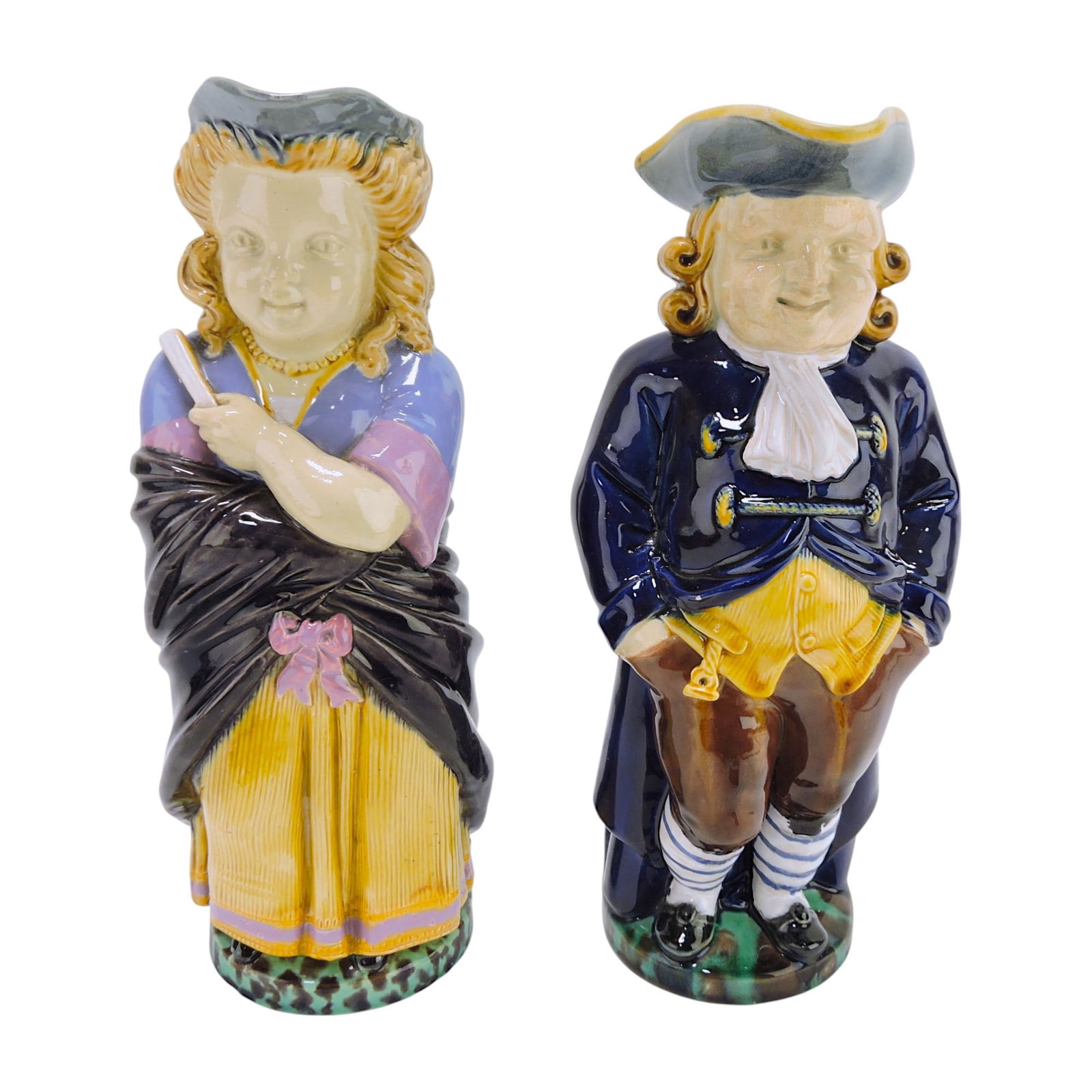 Minton majolica pair of toby jugs,: shape no. 1140 & 1130, repair to corner of gentleman's hat, 11 1/2"
