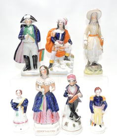 Seven Staffordshire figures to include a small pair of