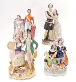 Four Staffordshire figures including a captioned figure of
