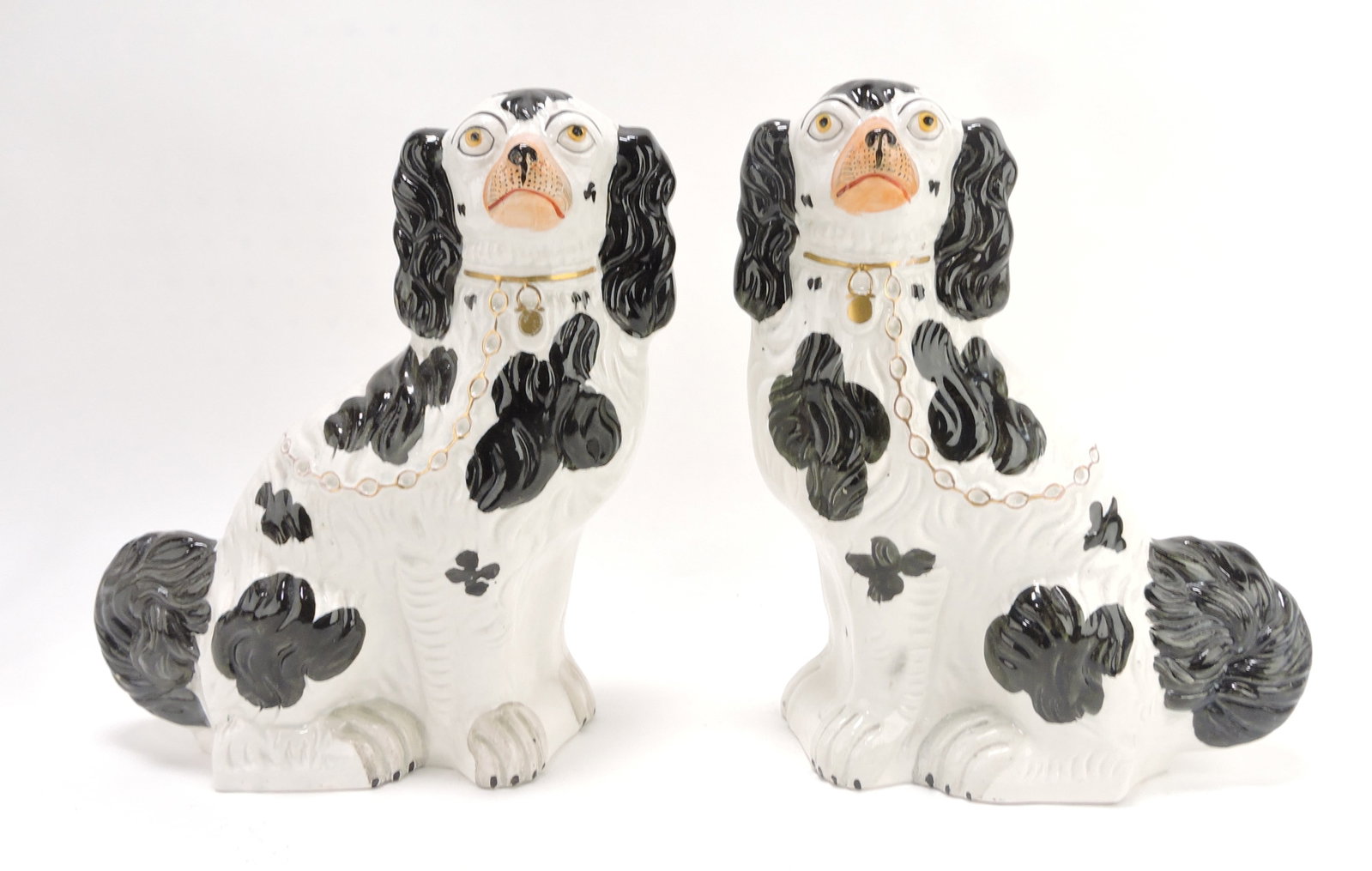 Staffordshire pair of black & white: spaniels marked #1, minor hairline to underside of one, 13"