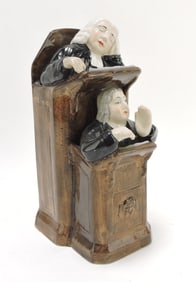 Staffordshire sleeping judge figure,