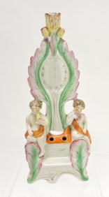Staffordshire clock/candle holder