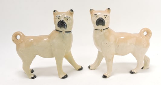 Staffordshire pair of pug dog figures,
