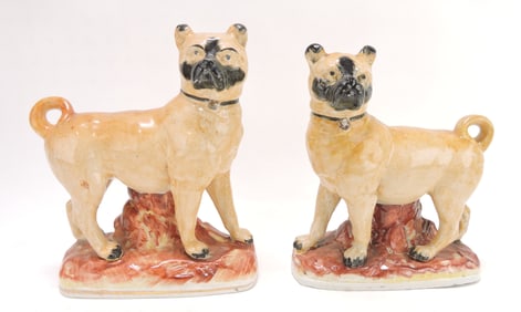 Staffordshire pair of pug dog figures,