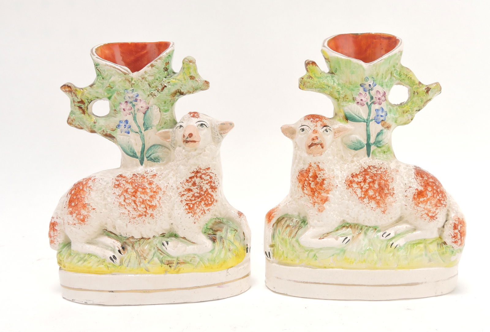 Staffordshire pair of sheep spill vases,: 6 1/2"