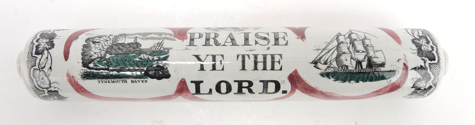 Staffordshire pink lustre and transferware: sailor's rolling pin, 'Praise Ye The Lord', Tynemouth Haven, and sailing ship, 15", minor nick