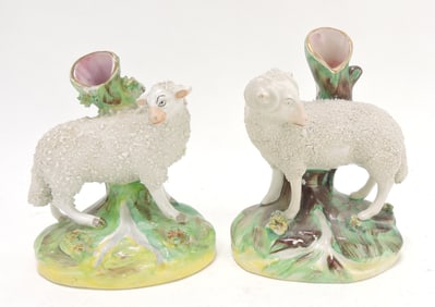 Staffordshire pair of sheep spill vases,
