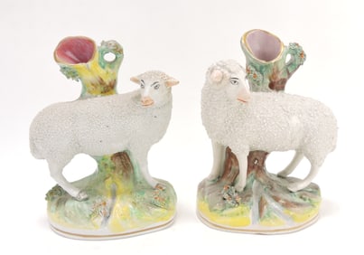 Staffordshire pair of sheep spill vases,