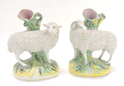 Staffordshire pair of sheep spill vases,