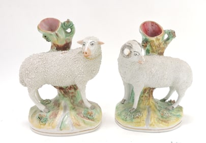 Staffordshire pair of sheep spill vases,