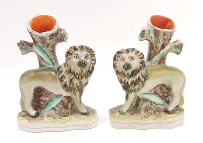 Staffordshire pair of lion spill vases,