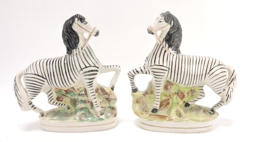 Staffordshire pair of zebra figures,