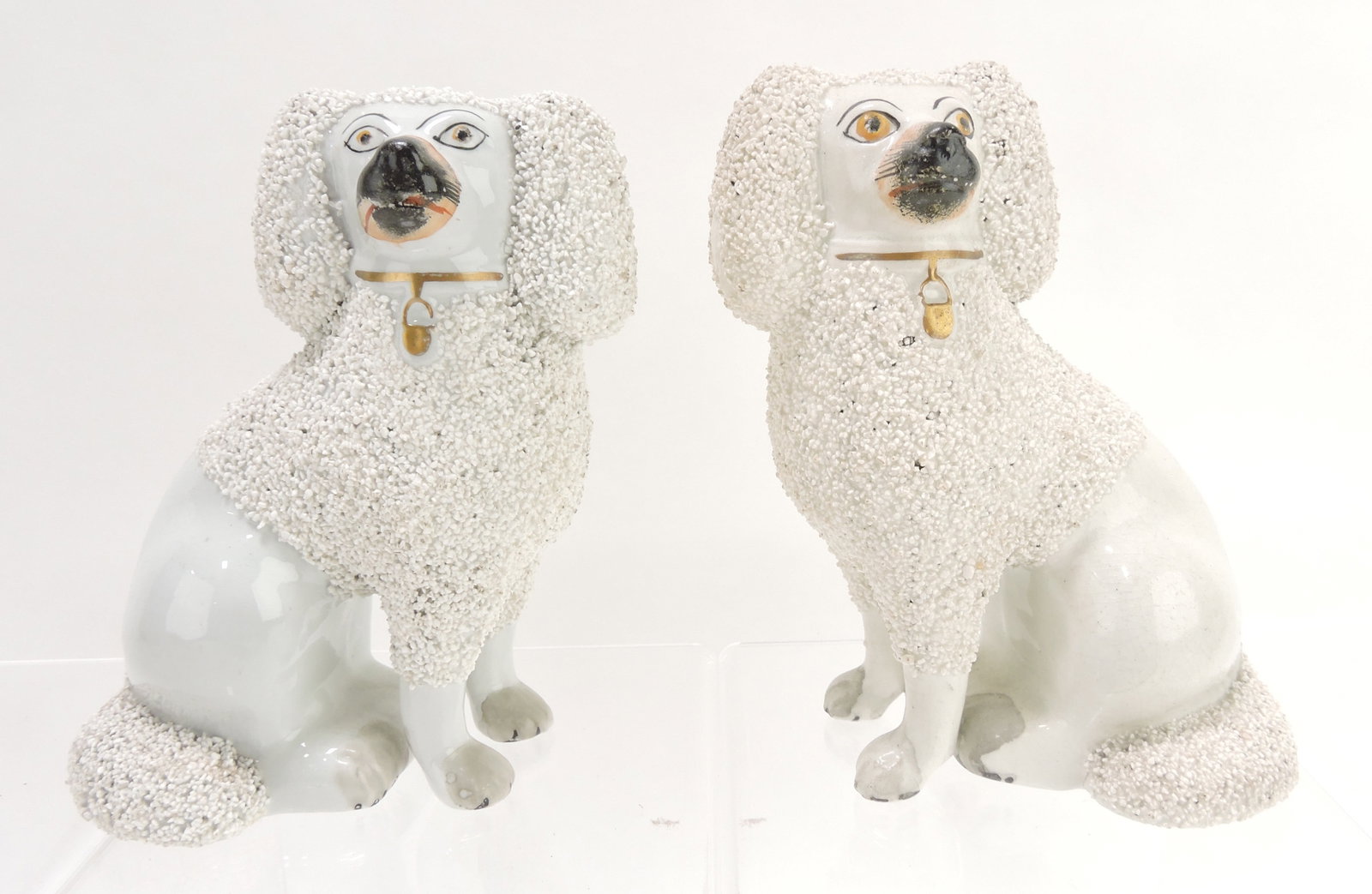 Staffordshire pair of free leg poodles,: 7"