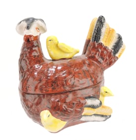 Staffordshire hen on nest with chicks,