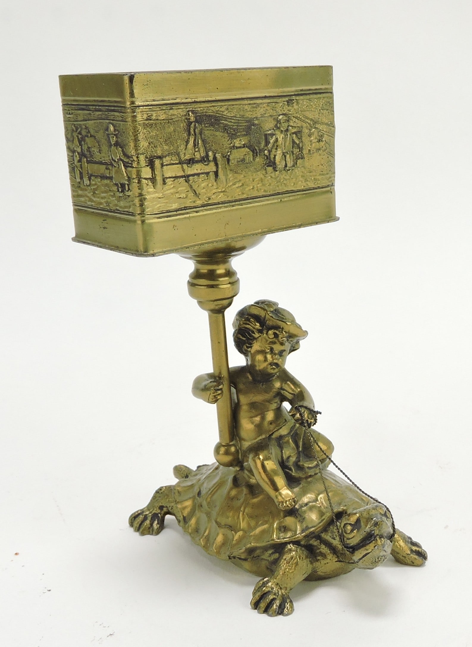 Pairpoint gold wash figural card/: cigarette holder with boy riding a tortoise, 5"