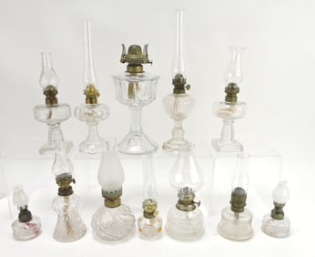Lot of 12 clear glass oil lamps,