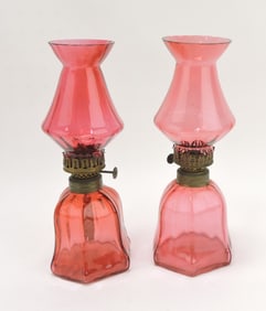 Cranberry pair of miniature oil lamps,