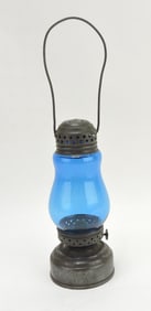 Jewel tin skater's lantern with blue