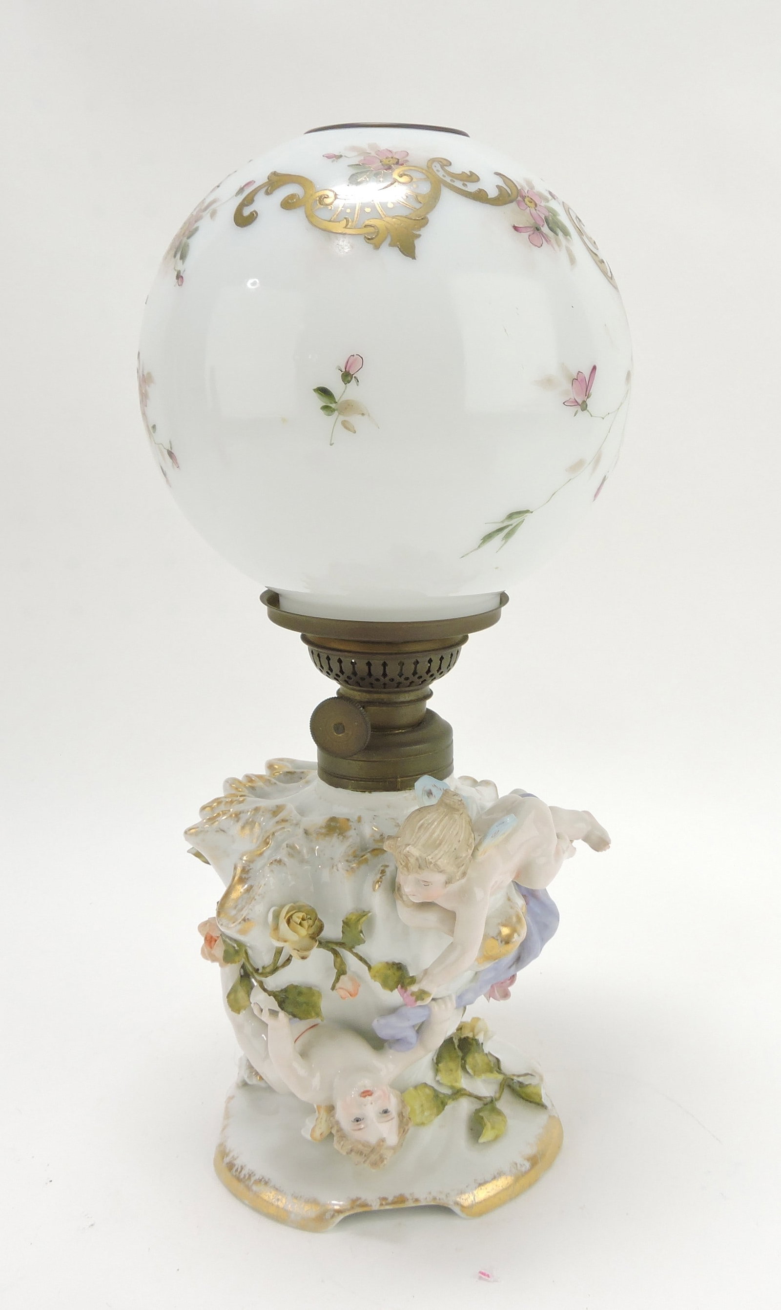 Meissen porcelain miniature oil lamp: with frolicking winged cherubs, 13"
