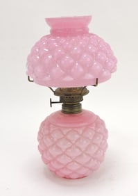 Pink cased glass miniature oil