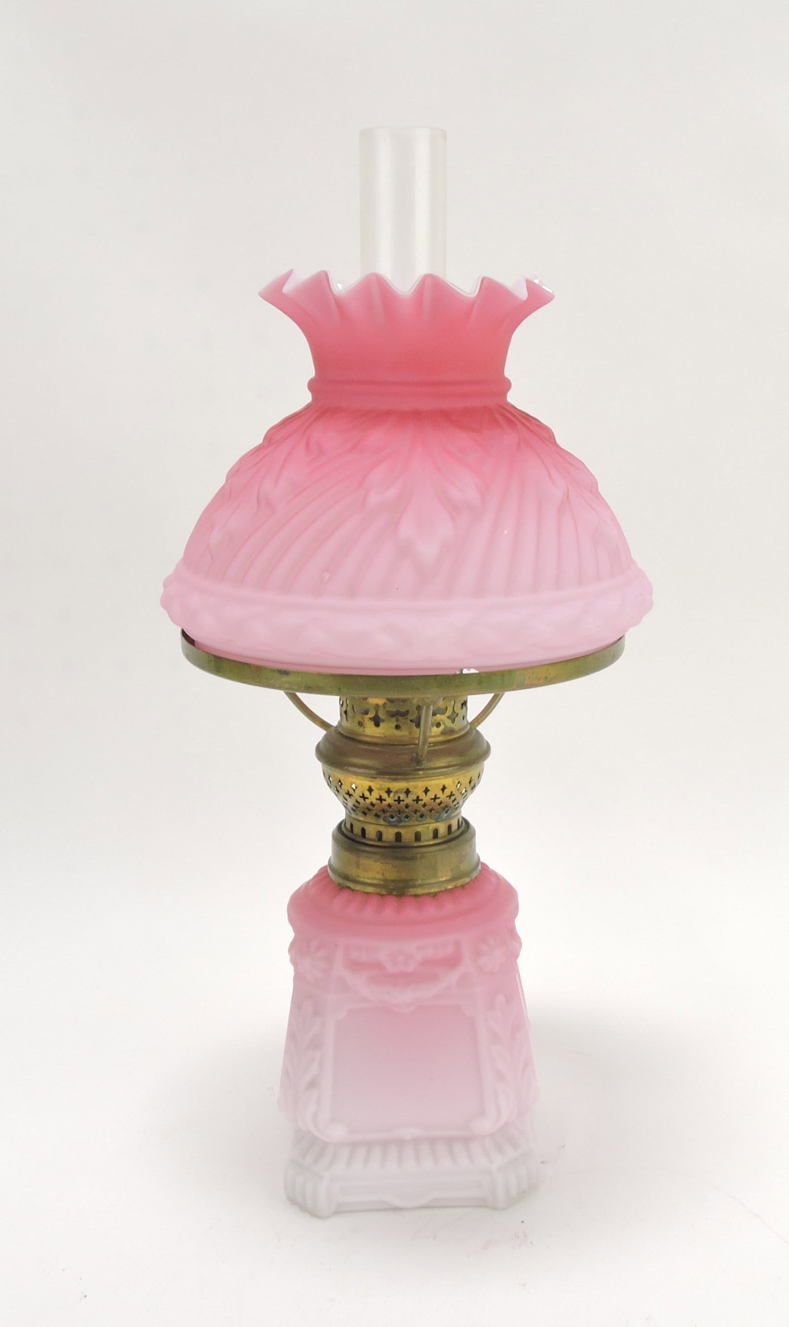 Pink satin cased glass embossed: miniature oil lamp, chip to bottom rim of shade, 12"
