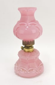 Pink cased glass miniature oil lamp,