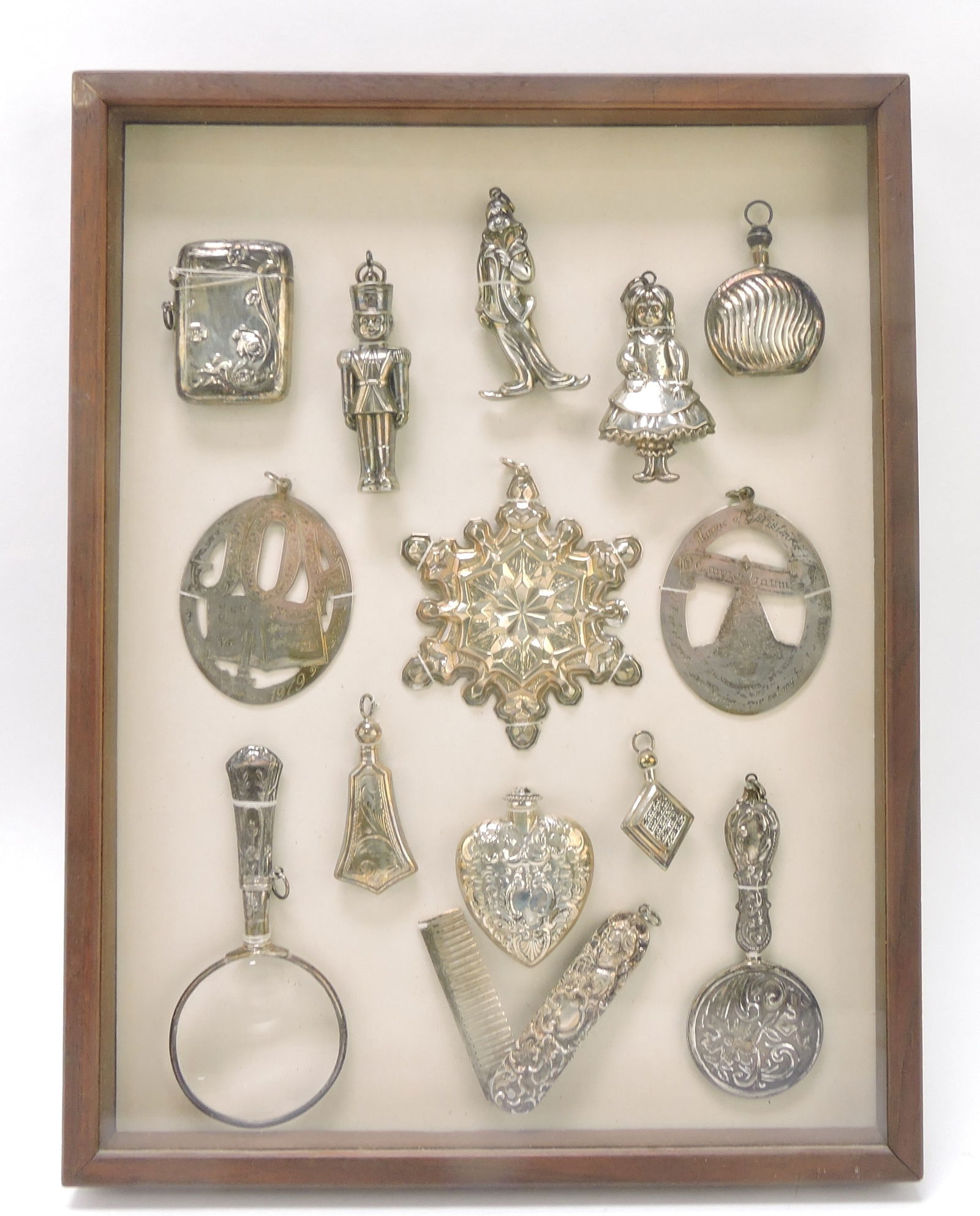 Frame of ornaments, match safe, and more: including sterling, 13 1/2"x9"