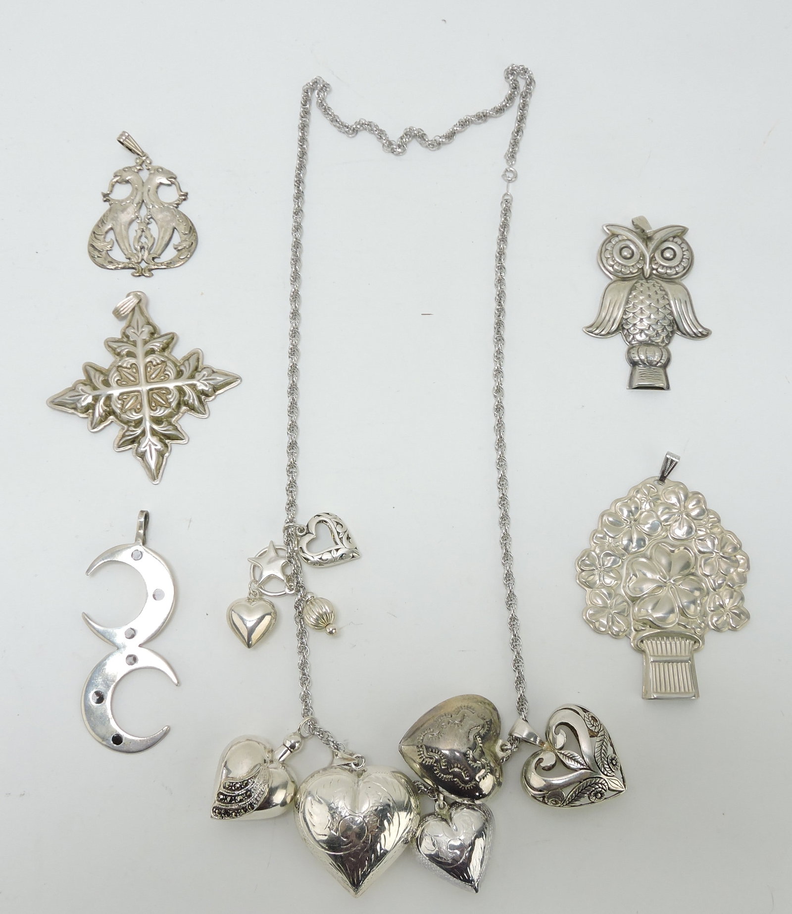 Sterling silver lot of pendants, necklaces,: and whistles, 4.3ozt