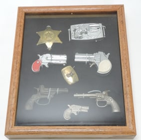 Frame of cap guns, buckles, and