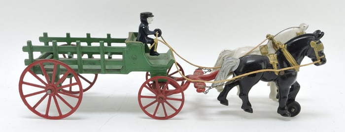 Cast iron horse drawn wagon with driver,