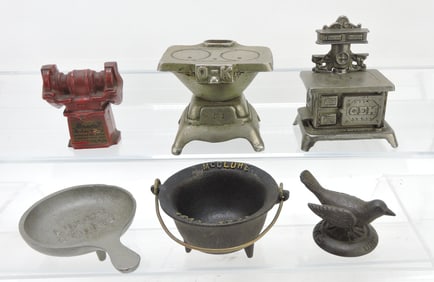 Lot of 6 cast iron advertising pieces: