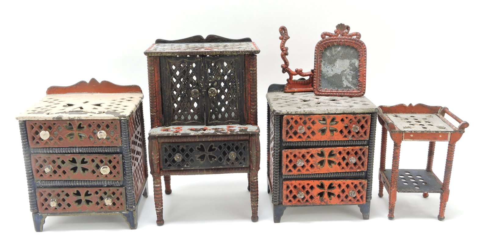 Cast iron doll house furniture lot of: 4 attributed to Stevens: hutch 8 1/2", chest 5", dresser with mirror (needs re-attached) 8 1/2", and washstand