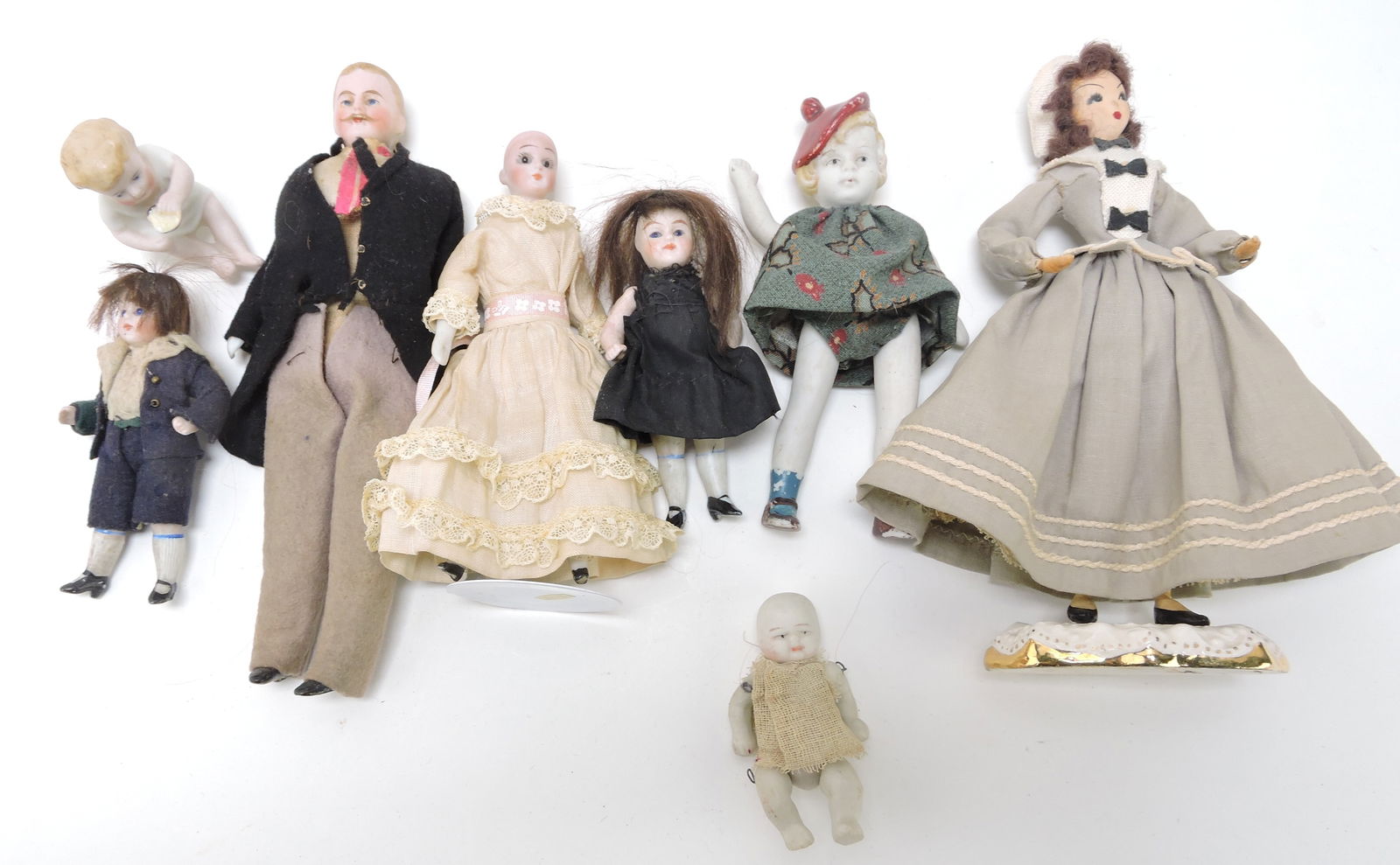 Lot of bisque, porcelain, and other dolls, (1 of 1)