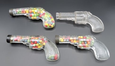 Lot of 4 glass candy container guns,